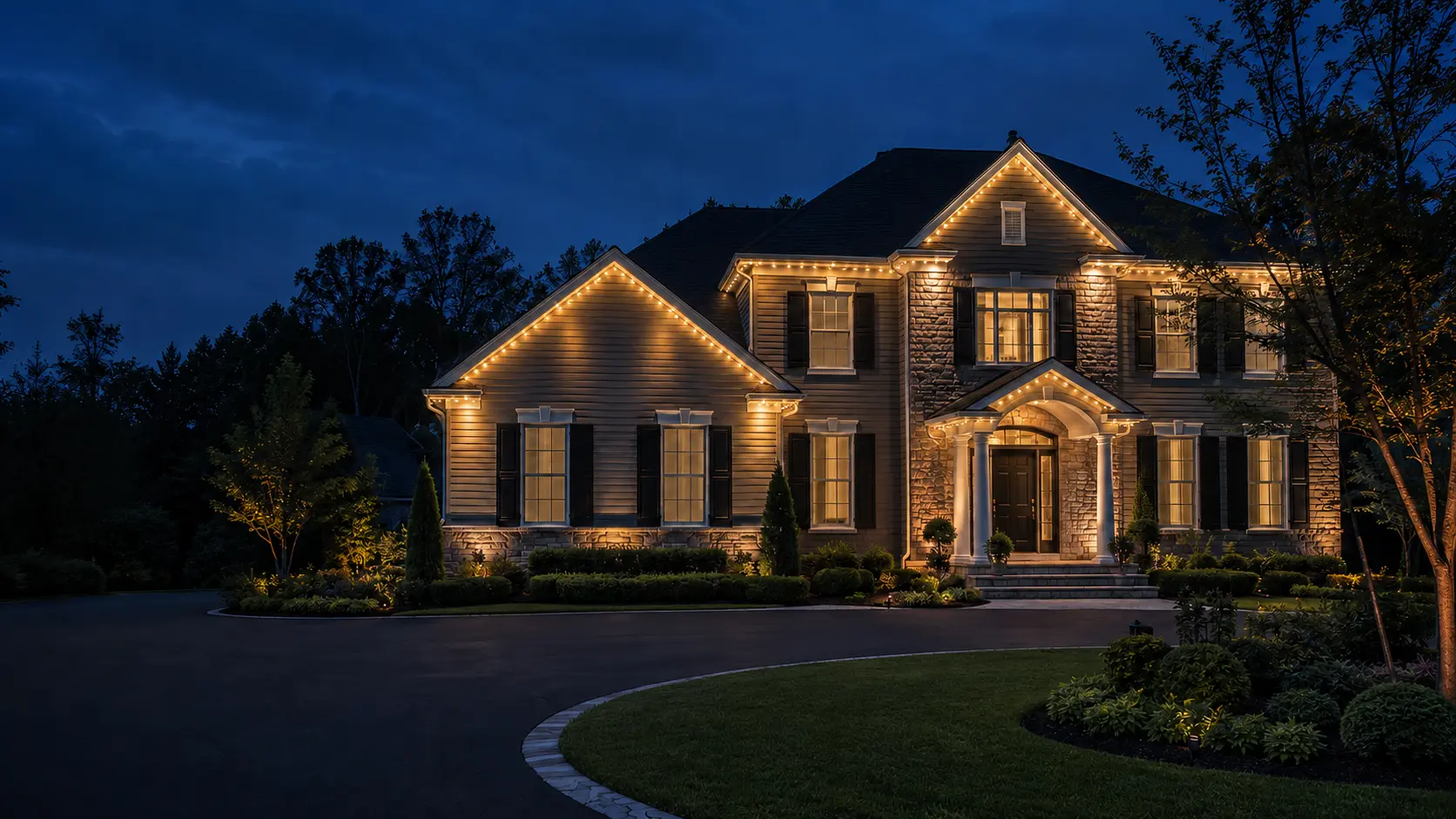Exterior lighting inspiration showing warm accents around planting beds and a home